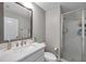 Bathroom featuring walk-in glass shower, tile flooring, a vanity, a toilet, and light gray walls at 5351 Bridge St # 81, Tampa, FL 33611