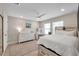 Bright bedroom with a ceiling fan, vanity, and large windows for ample natural light at 5351 Bridge St # 81, Tampa, FL 33611