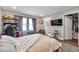 Bedroom features wood flooring, overhead lighting and full-sized bed with a view to the en suite at 5351 Bridge St # 81, Tampa, FL 33611
