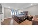 Spacious bedroom with dark wood furniture, including a bed, dresser and nightstand at 5351 Bridge St # 81, Tampa, FL 33611