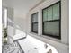 Exterior porch view with white posts and black window frames at 5351 Bridge St # 81, Tampa, FL 33611