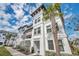 Stylish three-story condo in a coastal community with a lush palm tree at 5351 Bridge St # 81, Tampa, FL 33611