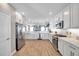 Beautiful kitchen with stainless steel appliances, white cabinetry, and tile flooring at 5351 Bridge St # 81, Tampa, FL 33611