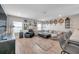 Inviting living room featuring wood floors, modern decor, a comfortable sectional couch, and great natural light at 5351 Bridge St # 81, Tampa, FL 33611