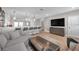 Bright, open-concept living room offers a seamless transition to the kitchen area, with a breakfast bar at 5351 Bridge St # 81, Tampa, FL 33611