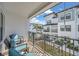 Charming patio boasts wrought iron railings and seating with views of the manicured neighborhood at 5351 Bridge St # 81, Tampa, FL 33611