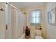 Functional bathroom with enclosed shower, tile floors, and a neutral color scheme at 612 Allegheny Dr, Sun City Center, FL 33573