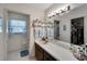 Bathroom with vanity, closet access, and decor at 612 Allegheny Dr, Sun City Center, FL 33573
