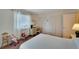 Bedroom includes closets, decor, and a desk near the window for natural light at 612 Allegheny Dr, Sun City Center, FL 33573
