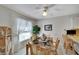 Bright dining area with a glass top table, comfortable seating, and ceiling fan at 612 Allegheny Dr, Sun City Center, FL 33573