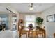 Cozy dining area featuring a glass-top table, seating, and view to the backyard at 612 Allegheny Dr, Sun City Center, FL 33573