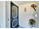 Charming front door with decorative glass and a welcoming flower arrangement at 612 Allegheny Dr, Sun City Center, FL 33573