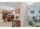 Hallway with front door entrance and view into dining room at 612 Allegheny Dr, Sun City Center, FL 33573