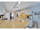 Functional kitchen with ample cabinetry, countertops, and a view of the living areas at 612 Allegheny Dr, Sun City Center, FL 33573