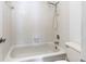 Standard bathroom with showerhead, white tile, and a bathtub at 6177 Sun Blvd # 401, St Petersburg, FL 33715