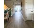 Hallway featuring wood-look tile flooring and neutral walls at 6440 Dutton Dr, Wesley Chapel, FL 33545