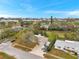 Aerial view of home and neighborhood in a coastal community at 9520 Portside Dr, Seminole, FL 33776