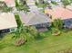 A screened in lanai and green backyard highlight this single Gathering home at 5062 Stone Harbor Cir, Wimauma, FL 33598