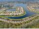 A beautiful waterfront neighborhood with the home in clear view at 5062 Stone Harbor Cir, Wimauma, FL 33598