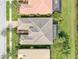 A bird's eye view of the home showcasing the roof, landscaping, and neighborhood at 5062 Stone Harbor Cir, Wimauma, FL 33598