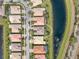 A nice home sits near a pond in a neighborhood at 5062 Stone Harbor Cir, Wimauma, FL 33598