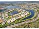 A waterfront community displays gorgeous homes on the water's edge at 5062 Stone Harbor Cir, Wimauma, FL 33598