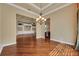 Spacious living room featuring hardwood floors, an open layout, and seamless flow into other living areas at 5062 Stone Harbor Cir, Wimauma, FL 33598