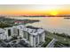 Stunning sunset aerial view of the building with ocean views at 1020 Sunset Point Rd # 703, Clearwater, FL 33755
