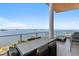Enjoy outdoor dining on this spacious balcony with clear water views from the comfort of your home at 1020 Sunset Point Rd # 703, Clearwater, FL 33755