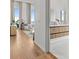 Modern bathroom with double vanity, walk-in shower, and beautiful hardwood floors at 1020 Sunset Point Rd # 703, Clearwater, FL 33755