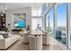 Modern dining room with water views and seating for six at 1020 Sunset Point Rd # 703, Clearwater, FL 33755