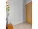Hallway with tile floors and a modern door at 1020 Sunset Point Rd # 703, Clearwater, FL 33755