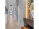 Hallway with artwork and recessed lighting at 1020 Sunset Point Rd # 703, Clearwater, FL 33755