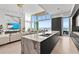 Modern open kitchen concept with an island, sleek cabinets, and an amazing water view at 1020 Sunset Point Rd # 703, Clearwater, FL 33755
