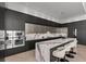 Chef's kitchen featuring marble island, stainless steel appliances, and counter seating at 1020 Sunset Point Rd # 703, Clearwater, FL 33755