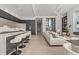 Open concept living space with a sleek kitchen and stylish furnishings at 1020 Sunset Point Rd # 703, Clearwater, FL 33755