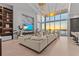 Bright living room with floor-to-ceiling windows and a stunning water view at 1020 Sunset Point Rd # 703, Clearwater, FL 33755