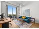 Bright living room with large windows, modern furniture, and access to outdoor seating at 1020 Sunset Point Rd # 703, Clearwater, FL 33755
