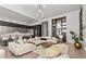 Open-concept living space with stylish furnishings, open kitchen, and elegant bar at 1020 Sunset Point Rd # 703, Clearwater, FL 33755