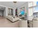 Open-concept living space features a modern dining area, sleek furniture, and great lighting at 1020 Sunset Point Rd # 703, Clearwater, FL 33755