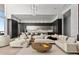 Spacious living room with comfortable seating, elegant decor, and water views at 1020 Sunset Point Rd # 703, Clearwater, FL 33755