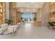 Elegant building lobby with modern design, sleek furniture, and sun-drenched entrance at 1020 Sunset Point Rd # 703, Clearwater, FL 33755