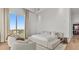 Bright bedroom with a comfortable sitting area and neutral decor at 1020 Sunset Point Rd # 703, Clearwater, FL 33755