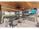 Grill and entertain in style with this outdoor kitchen, featuring modern appliances and ample seating at 1020 Sunset Point Rd # 703, Clearwater, FL 33755
