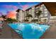 Enjoy a refreshing swim in the luxurious pool, set against a backdrop of tropical landscaping and modern architecture at 1020 Sunset Point Rd # 703, Clearwater, FL 33755