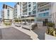 Relaxing poolside lounge area with shaded daybeds and comfortable seating, perfect for enjoying sunny days at 1020 Sunset Point Rd # 703, Clearwater, FL 33755