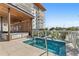 Inviting rooftop pool with a hot tub, lounging area, and beautiful views of the surrounding area at 1020 Sunset Point Rd # 703, Clearwater, FL 33755