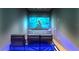 Cozy home theater room featuring comfortable seating and a large screen for entertainment with a modern aesthetic at 1020 Sunset Point Rd # 703, Clearwater, FL 33755