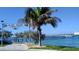 Picturesque view of ROC Park with palm trees, waterfront, and pier, perfect for outdoor activities at 11730 Gulf Blvd # 5, Treasure Island, FL 33706