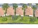 Birds eye view of houses with manicured lawns and mature trees in a quiet neighborhood at 1219 Huntington Greens Dr, Sun City Center, FL 33573